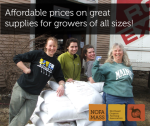 Four women stand near a stack of 50 lb. bags